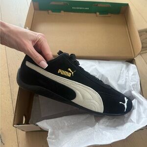 Puma Women’s Black and Cream Sneakers